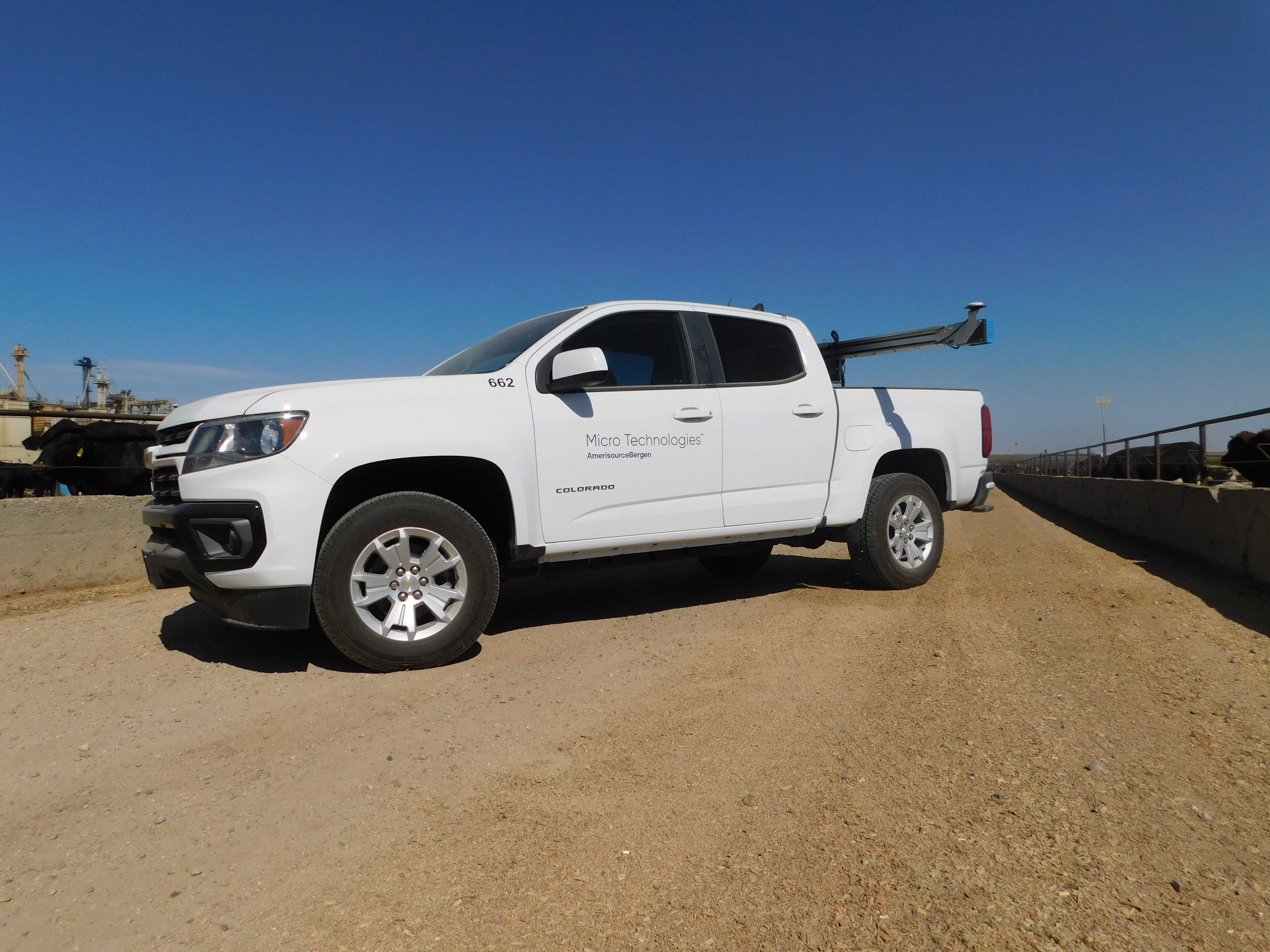 Micro Technologies white pickup truck